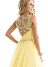 Open back in yellow evening dress