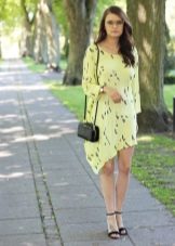 Asymmetric summer dress in combination with black sandals