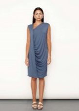 Blue asymmetrical dress with white sandals