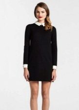 Short black dress in a straight silhouette with white cuffs and a collar