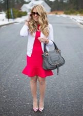 Dress with flounces paired with a cardigan and pumps