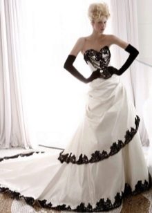wedding dress with black lace on the edge of the skirt