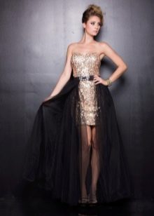 Short gold and black dress with a train