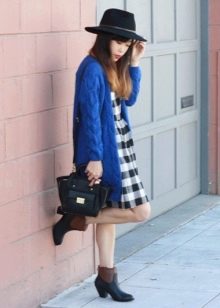 Pinafore dress paired with a hat, cardigan and low-heeled boots