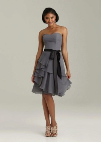 Dress with asymmetrically sewn flounces on the skirt