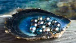 How are pearls formed and where can they be found?