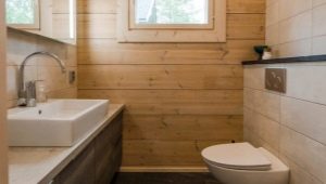 Arrangement of a bathroom in a wooden house