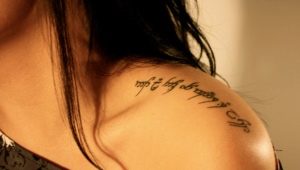 Tattoo in the form of inscriptions for girls