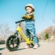 At what age can a balance bike be used and what is the reason?