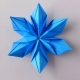 Wie macht man eine Schneeflocke mit Origami-Technik und was wird dafür benötigt?