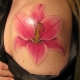 What does the Lily tattoo for girls symbolize and what is it like?