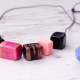 A variety of polymer clay jewelry and their care