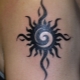 Black sun tattoo: kahulugan at application zone